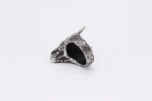 Detail of vintage silver dragon head ring featuring intricate scale textures and oxidized finish