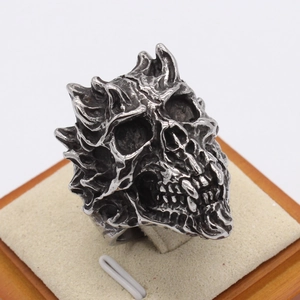 Retro punk demon skull ring for men with oxidized steel finish and flame texture