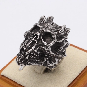 Gothic skull ring in retro silver steel finish with detailed flame engravings