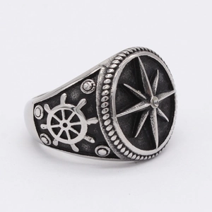 Retro nautical men's ring featuring a compass star design and embossed ship rudder detail