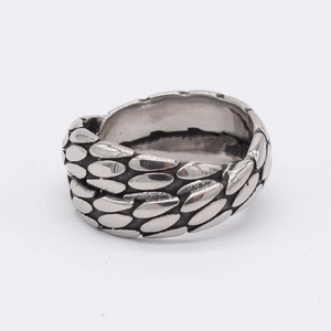 Retro stainless steel cross X ring with antique silver scale texture on white background