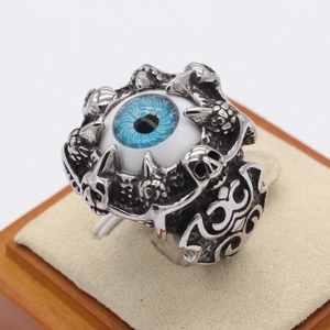 Gothic evil eye skull ring in vintage stainless steel with blue eye and claw design