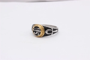 Detail of vintage Eye of Horus ring showing golden relief and Ankh cross on the side