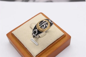 Detail of retro Egyptian Eye of Horus and Ankh symbols on a vintage steel ring