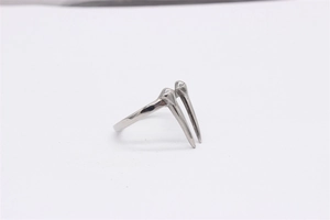 Detailed view of retro stainless steel ring with unique sharp spikes in polished silver finish