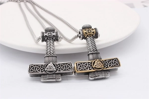 Detailed view of Viking Thor's Hammer pendants with Valknut symbol in retro steel