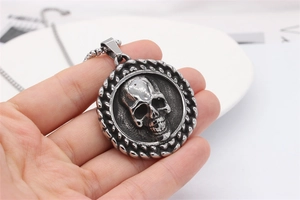 Detailed macro view of retro skull pendant with 3D embossed texture and braided edge