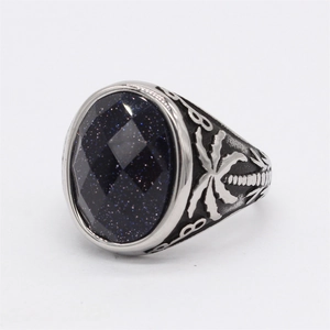 Bague rétro en acier titane avec grès bleu ovale et motifs de palmiers gravés