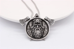 Detail view of a Nordic Viking axe pendant with a berserker warrior and Celtic knot pattern
