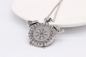 Detail of Viking compass necklace with engraved Valhalla quote and crossed axes on back