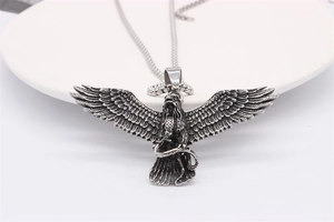 Detailed view of vintage eagle pendant with snake in gothic stainless steel finish