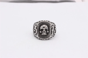 Detailed view of retro stainless steel skull ring with number 13 in gothic punk style