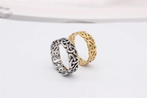 Detail of vintage Celtic knot rings in antique silver and matte gold titanium steel