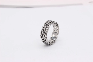 Macro shot of silver Celtic Triquetra knot ring with vintage blackened finish