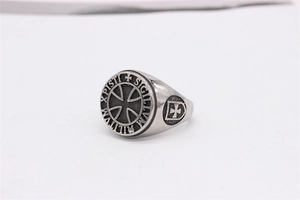 Detail of vintage steel ring featuring Knights Templar cross and Latin inscription