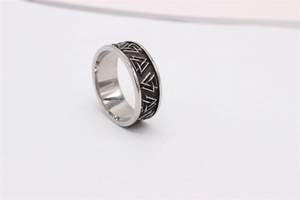 Close-up of engraved Valknut triangles on vintage silver titanium steel ring band