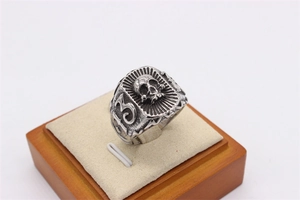Detail of vintage gothic skull ring featuring the number 13 on a jewelry display stand