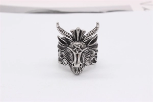 Detailed view of goat head ring with curved horns and pentagram in vintage silver