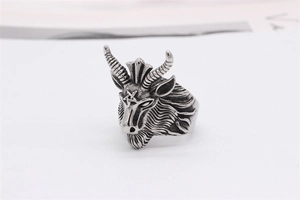 Detailed view of gothic goat head ring in vintage silver finish with pentagram engraving