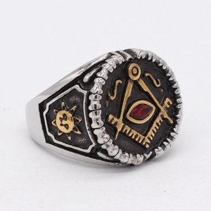 Vintage Masonic stainless steel ring with red gemstone and sun pattern on the side