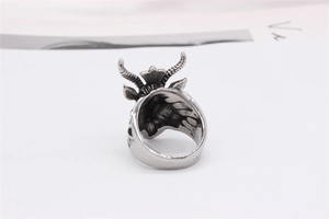 Macro detail of retro bull head ring showing intricate engraved textures and antique finish