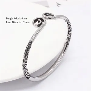 Retro eagle style silver stainless steel open bangle with intricate cloud engravings
