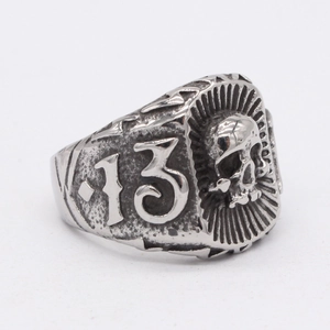 Retro punk style titanium steel ring with skull relief and number 13 on a white background