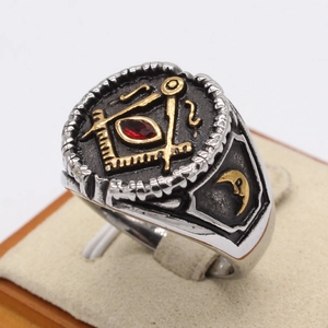 Vintage Freemasonry ring with red marquise stone and golden moon relief on steel
