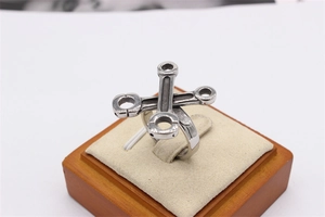 Detailed view of silver titanium steel ring featuring industrial wrench and engine rod design