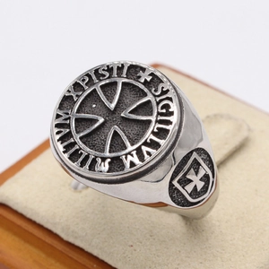 Vintage Knights Templar cross signet ring in oxidized steel on a display stand