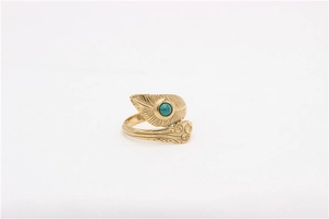 Detailed close-up of vintage gold feather ring featuring a round turquoise stone
