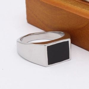 Minimalist men's silver stainless steel signet ring with black rectangular inlay design