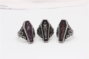 Detail view of gothic coffin rings with colorful enamel and relief carvings