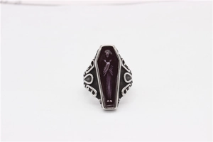 Detailed close-up of gothic mummy coffin ring featuring vintage patterns and enamel inlay