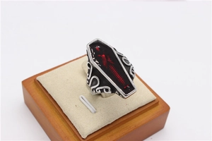 Detailed relief patterns on punk coffin ring with red scratched pattern detail