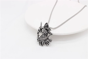 Detailed view of the Grim Reaper pendant necklace in vintage silver finish steel