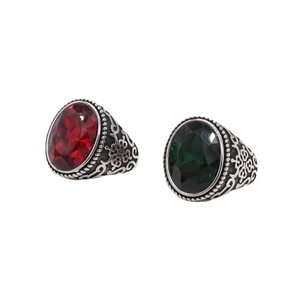 Vintage style rings set featuring red and green oval gemstones with silver engravings