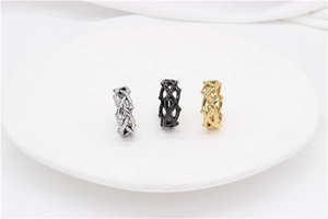 Detailed trio of silver, black, and gold thorn crown rings in punk stainless steel style
