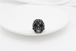 Macro detail of gothic skull ring with vintage oxidized finish and intricate carvings