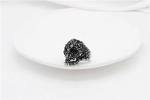 Macro shot of retro skull ring detailing with textured surface and vintage steel finish