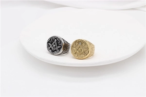Detailed engraving of Masonic square and compass with skull on gold and silver signet rings