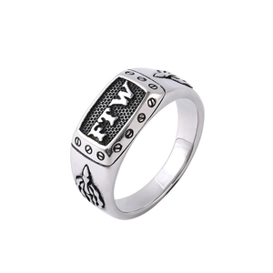 Detail view of punk style ring with FTW letters on honeycomb texture and flame reliefs