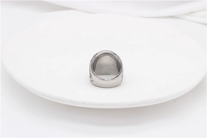 Macro detail of vintage engraved textures on the silver stainless steel ring band