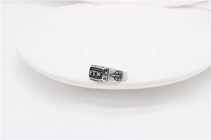 Macro shot of retro FTW stainless steel ring with detailed side bone engravings