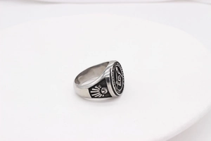 Close-up of Masonic compass logo and Latin engraving on vintage stainless steel signet ring
