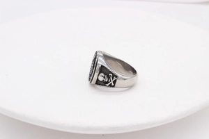 Detailed relief of skull and crossbones on vintage stainless steel punk ring band