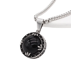 Men's titanium steel necklace with a round black gemstone pendant and vintage relief patterns