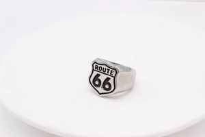 Macro view of vintage Route 66 shield logo on polished stainless steel ring