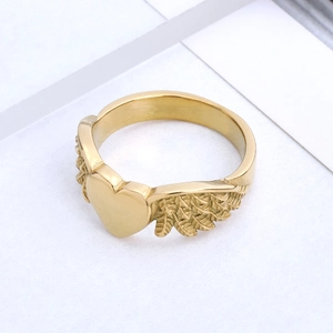 Golden heart wing ring in stainless steel with detailed feather texture for men and women
