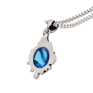 Vintage sapphire blue gemstone pendant necklace with flame motif in antique steel